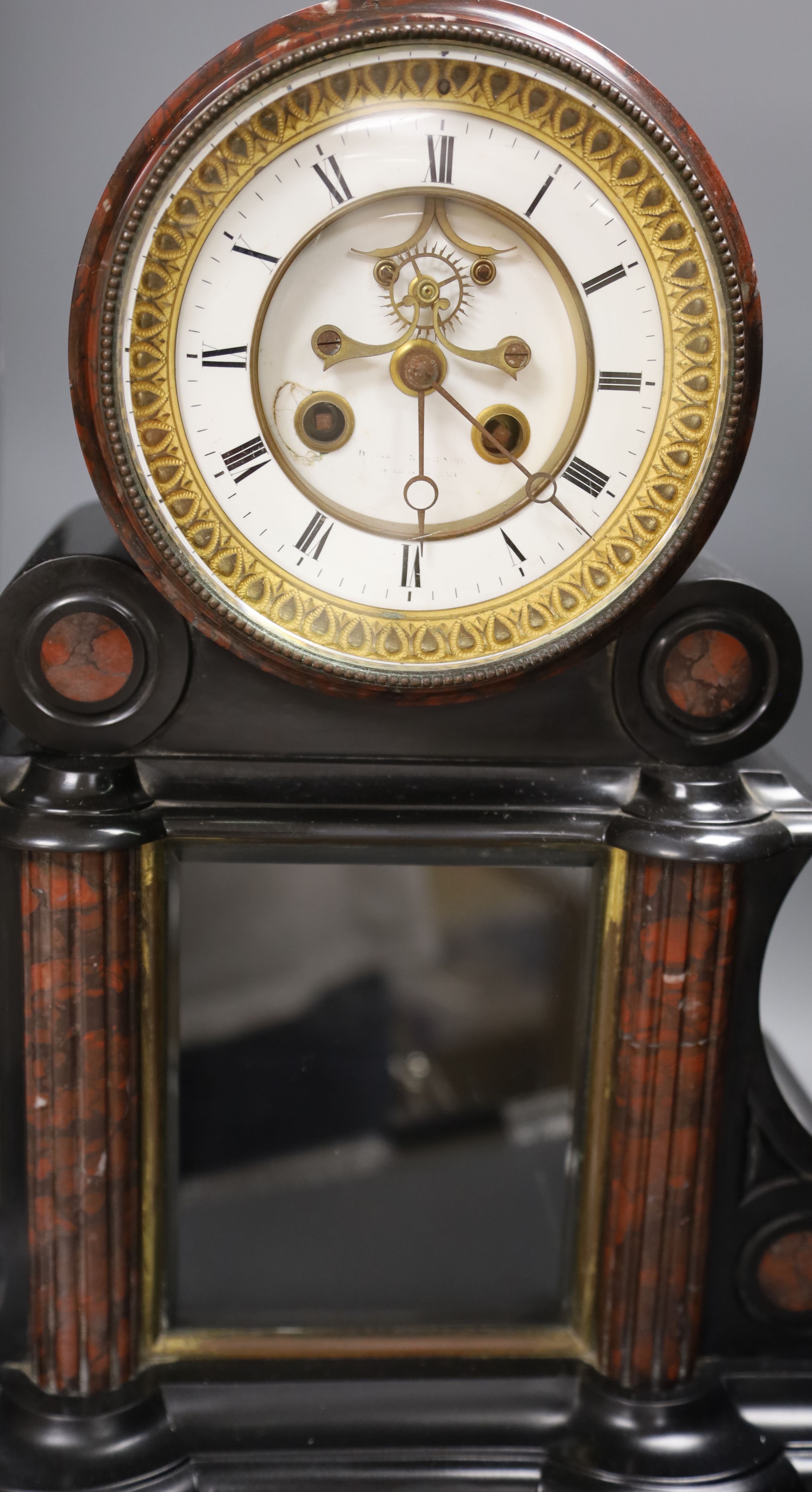 A Victorian black slate and rouge marble mantel clock, height 46cm